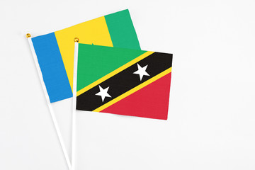 Saint Kitts And Nevis and Saint Vincent And The Grenadines stick flags on white background. High...