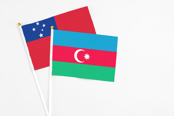 Azerbaijan and Samoa stick flags on white background. High quality fabric, miniature national flag. Peaceful global concept.White floor for copy space.
