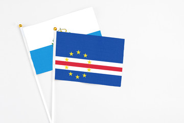Cape Verde and San Marino stick flags on white background. High quality fabric, miniature national flag. Peaceful global concept.White floor for copy space.