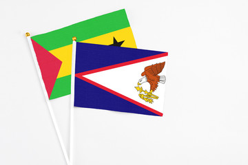 American Samoa and Sao Tome And Principe stick flags on white background. High quality fabric,...