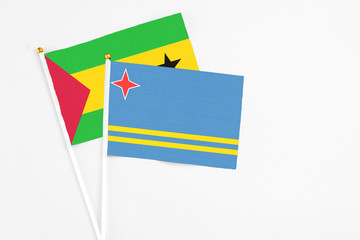 Aruba and Sao Tome And Principe stick flags on white background. High quality fabric, miniature...