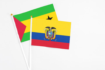Ecuador and Sao Tome And Principe stick flags on white background. High quality fabric, miniature national flag. Peaceful global concept.White floor for copy space.