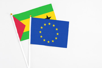 European Union and Sao Tome And Principe stick flags on white background. High quality fabric,...