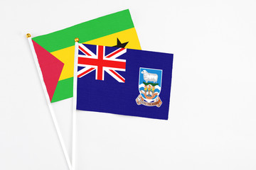 Falkland Islands and Sao Tome And Principe stick flags on white background. High quality fabric,...