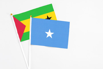 Somalia and Sao Tome And Principe stick flags on white background. High quality fabric, miniature national flag. Peaceful global concept.White floor for copy space.
