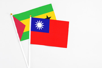 Taiwan and Sao Tome And Principe stick flags on white background. High quality fabric, miniature national flag. Peaceful global concept.White floor for copy space.