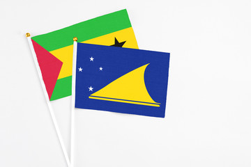 Tokelau and Sao Tome And Principe stick flags on white background. High quality fabric, miniature...