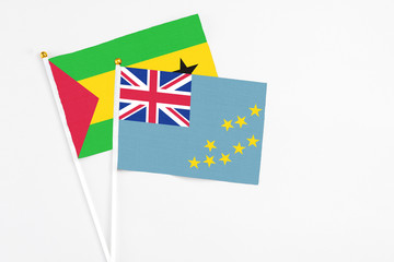 Tuvalu and Sao Tome And Principe stick flags on white background. High quality fabric, miniature...