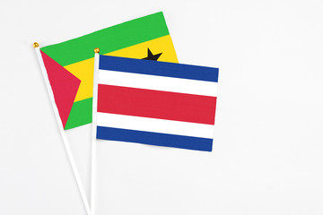 Costa Rica and Saudi Arabia stick flags on white background. High quality fabric, miniature national flag. Peaceful global concept.White floor for copy space.
