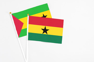 Ghana and Saudi Arabia stick flags on white background. High quality fabric, miniature national flag. Peaceful global concept.White floor for copy space.