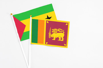 Sri Lanka and Saudi Arabia stick flags on white background. High quality fabric, miniature national flag. Peaceful global concept.White floor for copy space.