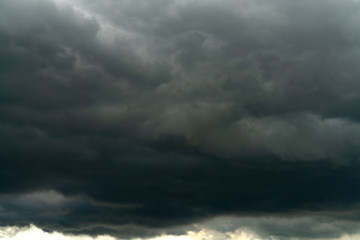 Fototapeta na wymiar Rain clouds and black sky textured background