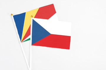 Czech Republic and Seychelles stick flags on white background. High quality fabric, miniature national flag. Peaceful global concept.White floor for copy space.v