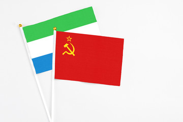 Soviet Union and Sierra Leone stick flags on white background. High quality fabric, miniature national flag. Peaceful global concept.White floor for copy space.