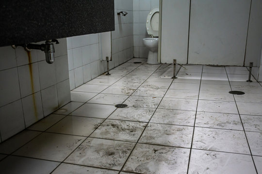 Dirty toilet in public building by human walk.