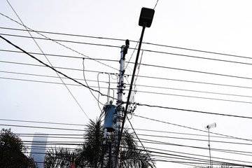 Complex roadside electrical wires with lamp post
