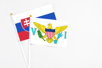 United States Virgin Islands and Slovakia stick flags on white background. High quality fabric, miniature national flag. Peaceful global concept.White floor for copy space.
