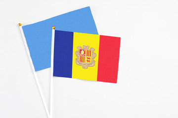 Andorra and Somalia stick flags on white background. High quality fabric, miniature national flag. Peaceful global concept.White floor for copy space.