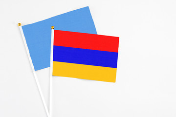 Armenia and Somalia stick flags on white background. High quality fabric, miniature national flag. Peaceful global concept.White floor for copy space.