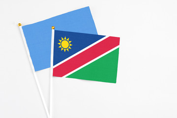 Namibia and Somalia stick flags on white background. High quality fabric, miniature national flag. Peaceful global concept.White floor for copy space.