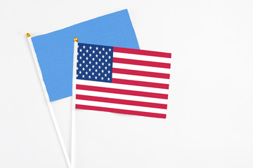 United States and Somalia stick flags on white background. High quality fabric, miniature national flag. Peaceful global concept.White floor for copy space.