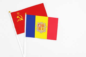 Andorra and Soviet Union stick flags on white background. High quality fabric, miniature national flag. Peaceful global concept.White floor for copy space.