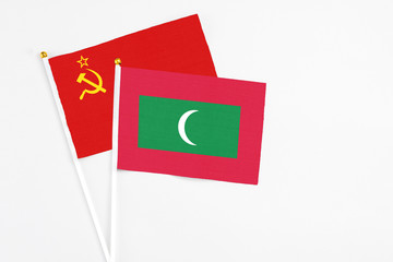 Maldives and Soviet Union stick flags on white background. High quality fabric, miniature national flag. Peaceful global concept.White floor for copy space.