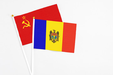 Fototapeta premium Moldova and Soviet Union stick flags on white background. High quality fabric, miniature national flag. Peaceful global concept.White floor for copy space.