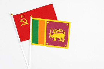 Sri Lanka and Soviet Union stick flags on white background. High quality fabric, miniature national flag. Peaceful global concept.White floor for copy space.