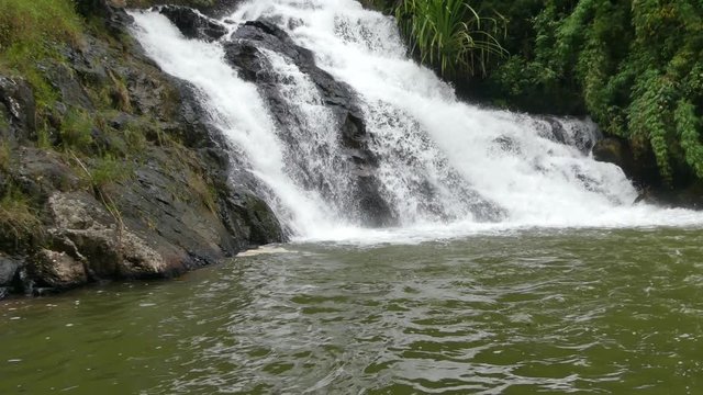 Datanla waterfall in DaLat, Vietnam. Track out from the river. Waterfall ends in the lake. Close view of waterfall and rivier. Waterfall in the forest.