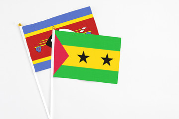 Sao Tome And Principe and Swaziland stick flags on white background. High quality fabric, miniature national flag. Peaceful global concept.White floor for copy space.