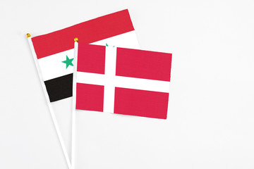 Denmark and Syria stick flags on white background. High quality fabric, miniature national flag....