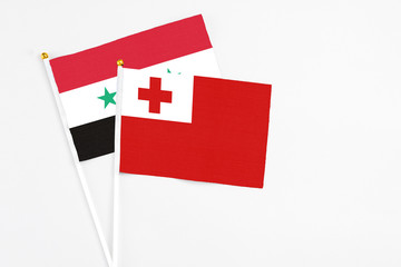 Tonga and Syria stick flags on white background. High quality fabric, miniature national flag....
