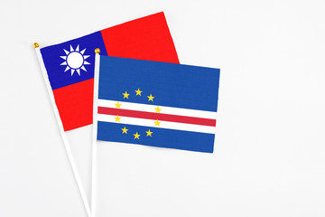 Cape Verde and Taiwan stick flags on white background. High quality fabric, miniature national flag. Peaceful global concept.White floor for copy space.