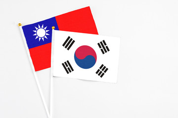 South Korea and Taiwan stick flags on white background. High quality fabric, miniature national flag. Peaceful global concept.White floor for copy space.