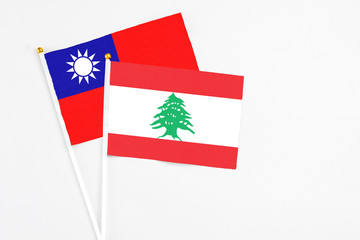 Lebanon and Taiwan stick flags on white background. High quality fabric, miniature national flag....