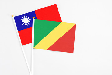 Republic Of The Congo and Taiwan stick flags on white background. High quality fabric, miniature national flag. Peaceful global concept.White floor for copy space.