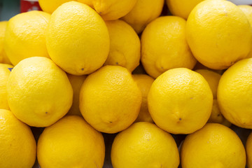 Lemon in various sizes, yellow color background in freshness.