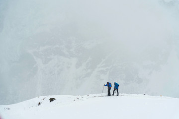 Fototapeta na wymiar Skier skiing on top of the Caucasus mountain in Russia.