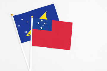 Samoa and Tokelau stick flags on white background. High quality fabric, miniature national flag....