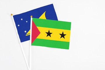 Sao Tome And Principe and Tokelau stick flags on white background. High quality fabric, miniature...