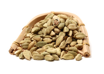 Green cardamom pods on white background