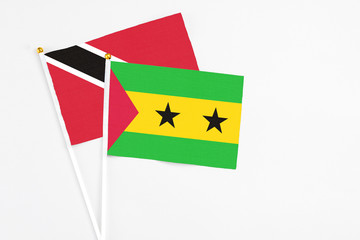 Sao Tome And Principe and Trinidad And Tobago stick flags on white background. High quality fabric,...