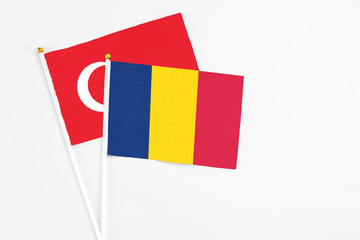 Chad and Turkey stick flags on white background. High quality fabric, miniature national flag. Peaceful global concept.White floor for copy space.