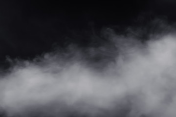 Smoke dry ice move down nearly floor with massive size, have hard contrast on black background. Move spread around in the air