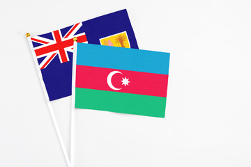 Azerbaijan and Turks And Caicos Islands stick flags on white background. High quality fabric, miniature national flag. Peaceful global concept.White floor for copy space.