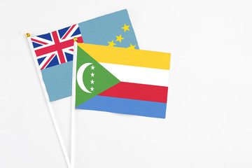Comoros and Tuvalu stick flags on white background. High quality fabric, miniature national flag....