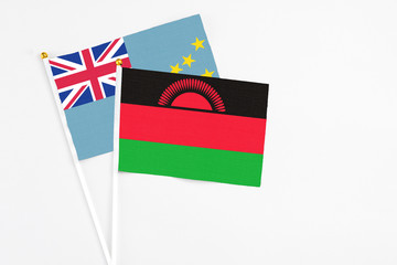 Malawi and Tuvalu stick flags on white background. High quality fabric, miniature national flag....