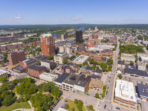 Manchester downtown building including City Hall Plaza and Brady Sullivan Plaza with Merrimack River at the background aerial view, Manchester, New Hampshire, NH, USA.