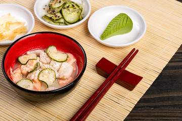 Salmon Ceviche with Cucumber and Black Pepper. Symbol of Peruvian Food. Served in a bowl.